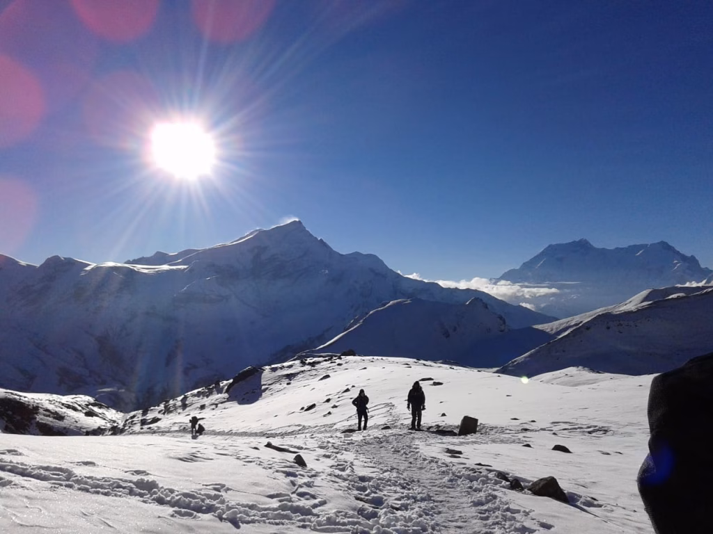 Sunlight on a snowy area with people