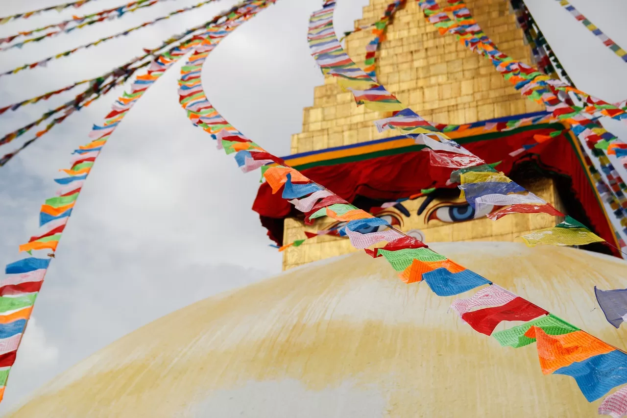 Stupa with Buddha eyes and colorful flags.