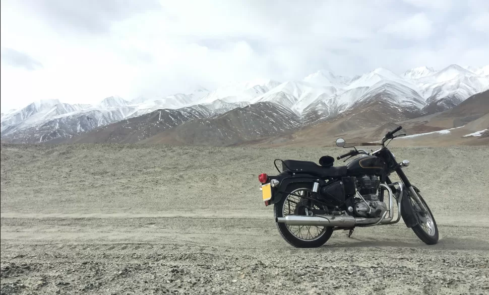 motorbike near mountains under clear sky