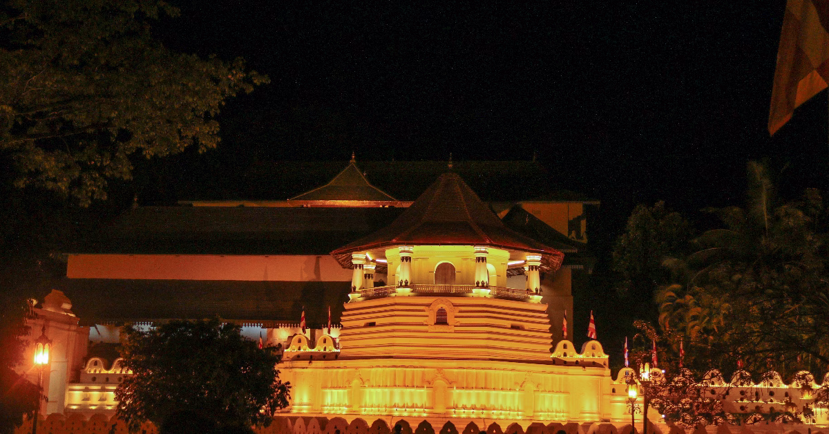 Brightly lit temple at night in Kandy, Sri Lanka